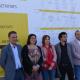 Los representantes municipales y del IVACE - CEEI Elche junto al cartel de los eventos 